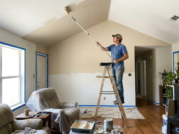 Rolling a vaulted ceiling with an extension pole in a Round Rock home